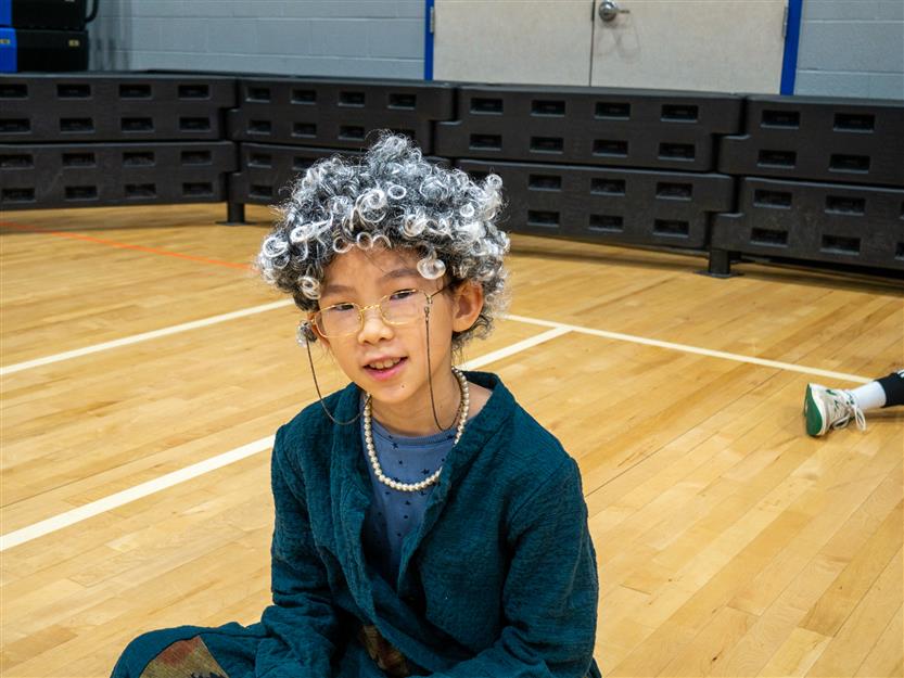 girl in the gym with a gray wig